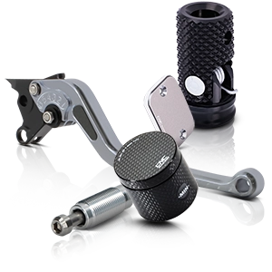 Motorcycle accessories: footrests, brake levers and reservoirs in carbon and metal look.